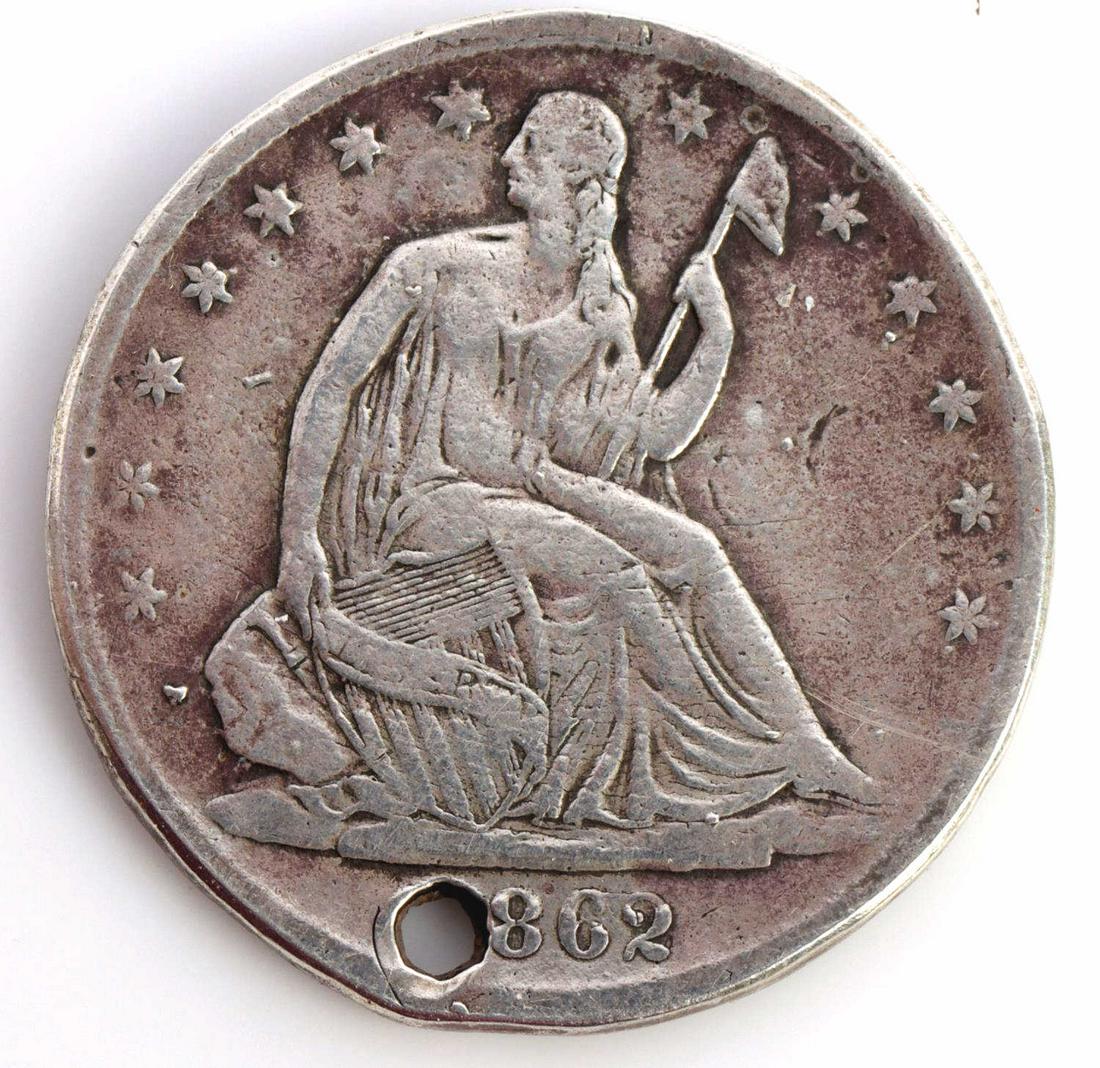 CONFEDERATE STATES CIVIL WAR NAMED DOG TAG: Confederate States Army Civil War Army Named Dog Tag 1862 Coin. Measures 1 1/8 inches in diameter. The front of the silver coin shows the seated Lady Liberty dollar coin dated 1862. The reverse side s
