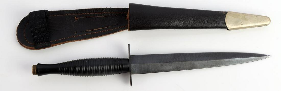 WWII BRITISH ARMY FAIRBAIRN SYKES COMABT KNIFE: British WWII Army Fairbairn Sykes Combat Knife & Scabbard. Measures 12 3/4 inches. Metal handle with a steel cross guard. The cross guard is marked ‘William Rogers Sheffield England’. Multi piece 