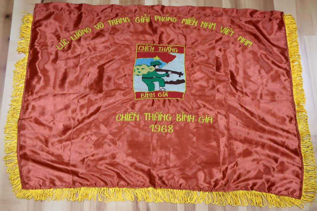 VIETNAM VIET CONG 1968 REGIMENTAL BANNER FLAG: Viet Nam Era Viet Cong 1966 Regimental Banner Flag. Measures 39 1/2” wide by 28 1/2"tall including the yellow satin fringe. The front reads ‘LUC LUONG VO TRANG GIAI PHONG MIENNAM NAMCHIEN THA