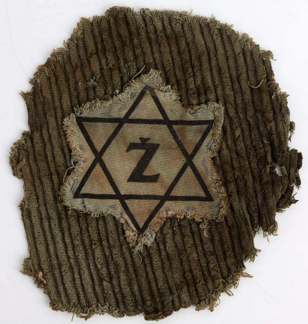 WWII GERMAN THIRD REICH UNIFORM STAR: German WWII Jewish Concentration Camp Z Uniform Star. The piece of corduroy background cloth the star it sewn onto measures 5 3/4 X 6 3/4 inches tall. The Jewish Star itselfmeasures 3 3/8” X 3 5/8 i