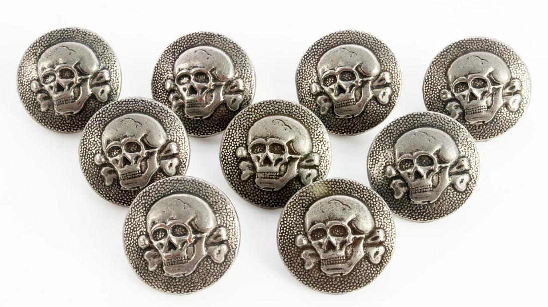 WWII GERMAN THIRD REICH SS TOTENKOPF BUTTONS: (9) German WWII Waffen SS Totenkopf Tunic Buttons. They measure 3/4 inches in diameter. The frontshows a skull with cross bones. The reverse side is maker marked ‘A RZM 155/38 SS’. Nickelconstruct