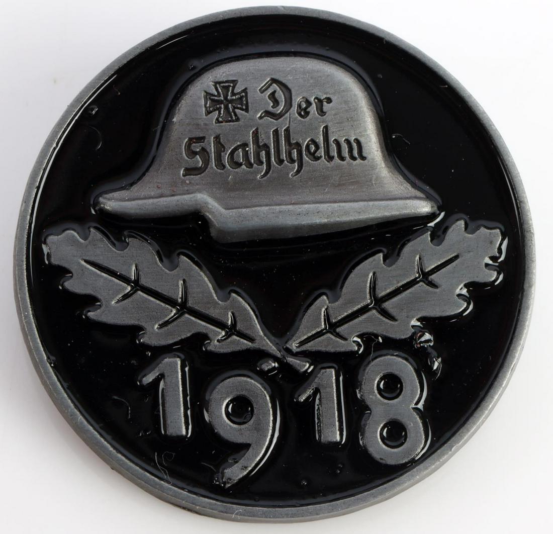 WWII GERMAN THIRD REICH STAHLHELM MEMBER BADGE: Measures 1 3/16 inches in diameter. Shows profile of a German Helmet with 2 oak leaves in the center. Base dated 1918. Reverse named to George Seldte. Unauthenticated, sold as is.