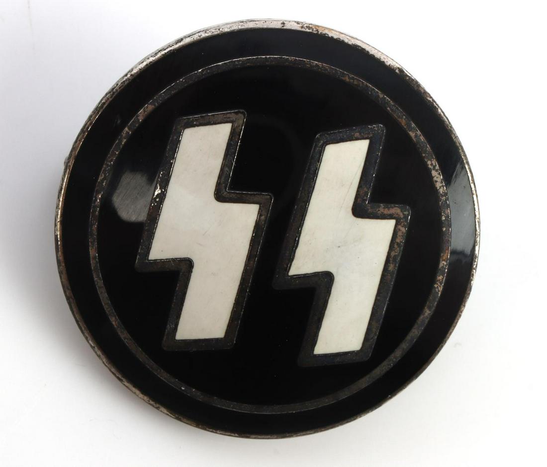 WWII GERMAN THIRD REICH SS MEMBER BADGE PIN: German WWII Waffen SS Party Runic Lapel Badge. Measures 7/8 inches in diameter. The front shows a pair of Waffen SS runes in the center. The reverse side is maker marked ‘RZM M1/4 Ges Gesch’. Has 