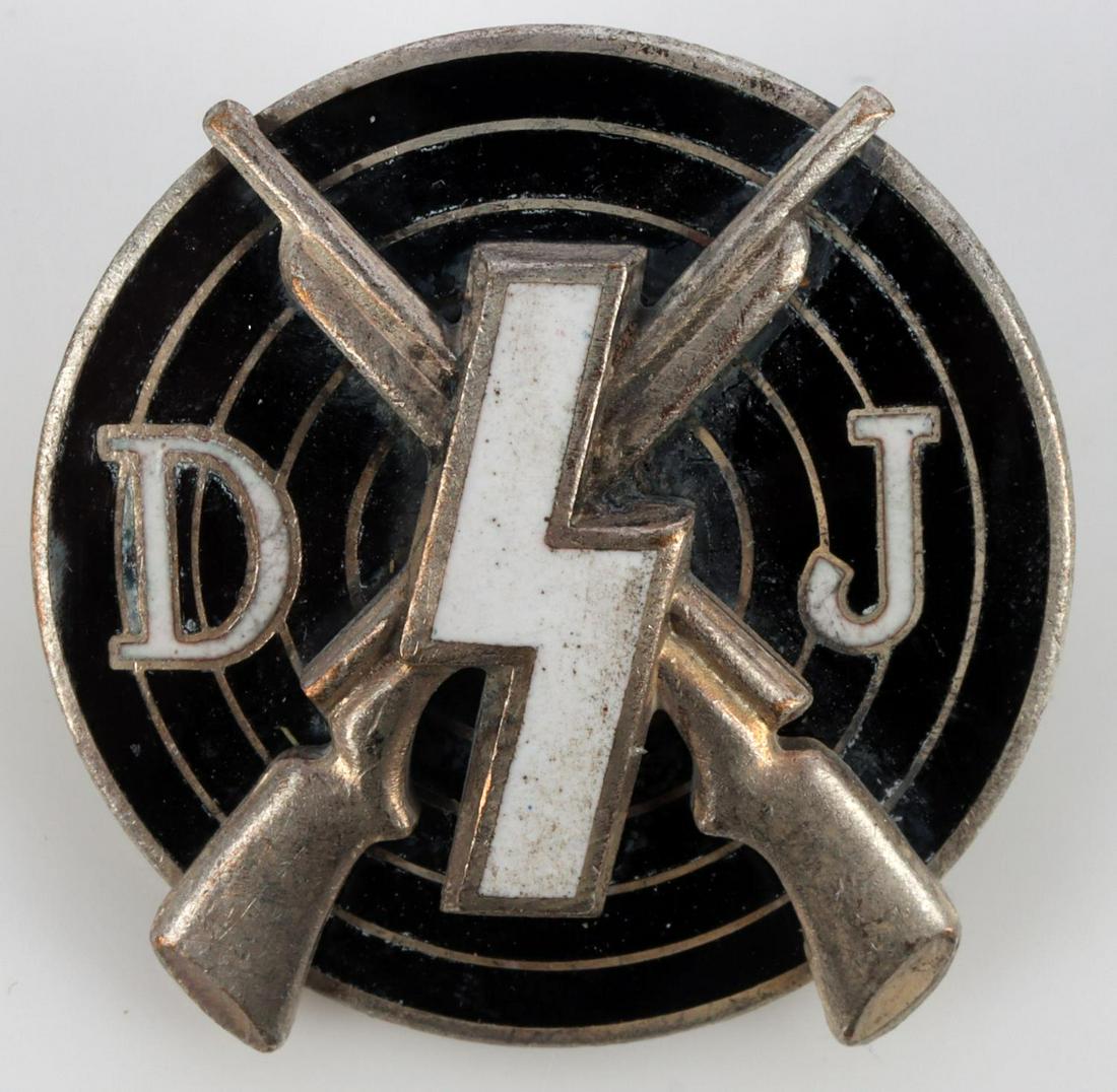 WWII GERMAN DJ MARKSMAN SHOOTING BADGE: German WWII Deutsches Jungend DJ Marksman Shooting Badge. Measures 13/16 inch diameter. Front shows a DJ rune with a pair of cross rifles in the back ground mounted on a bulls eye target with the lett