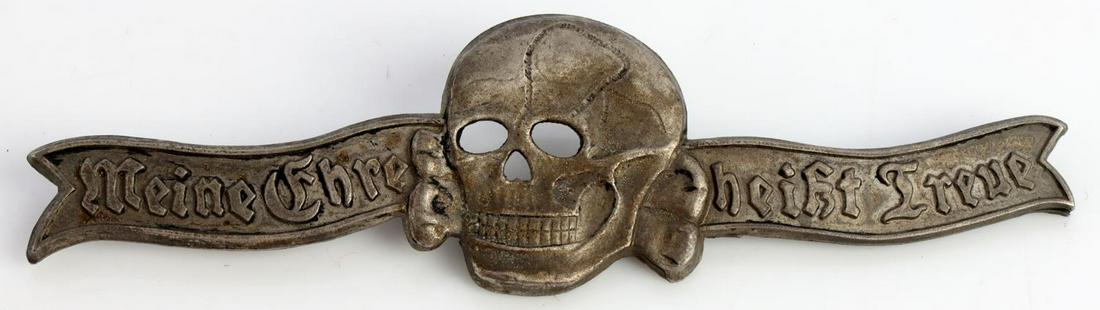 WWII GERMAN WAFFEN SS MEMBERSHIP BADGE: German WWII Waffen-SS Formal Dress Breast Badge. Measures 4 1/8 X 1 inches. Front shows a totenkopf and reads ‘Meine Ehre heist Treue’ (My Honor is Loyalty). Thin horizontal pin back with a c catc