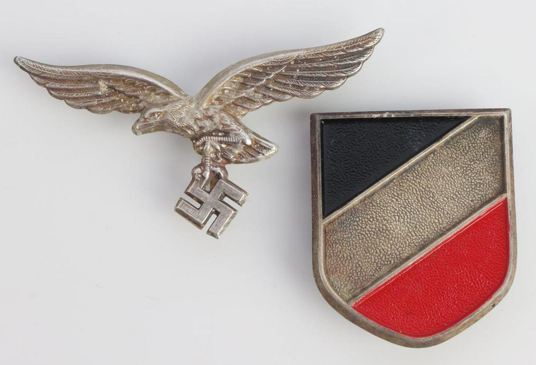 WWII GERMAN LUFTWAFFE AFRIKA PITH SHIELD AND EAGLE: German WWII Luftwaffe Afrika Korps Pith Helmet Eagle & Shield. Front shows a Luftwaffe eagle. It measures 2 5/8 X 1 3/8 inches. Includes the national colors shield. It measures 1 3/8 X 1 5/8 inches. B
