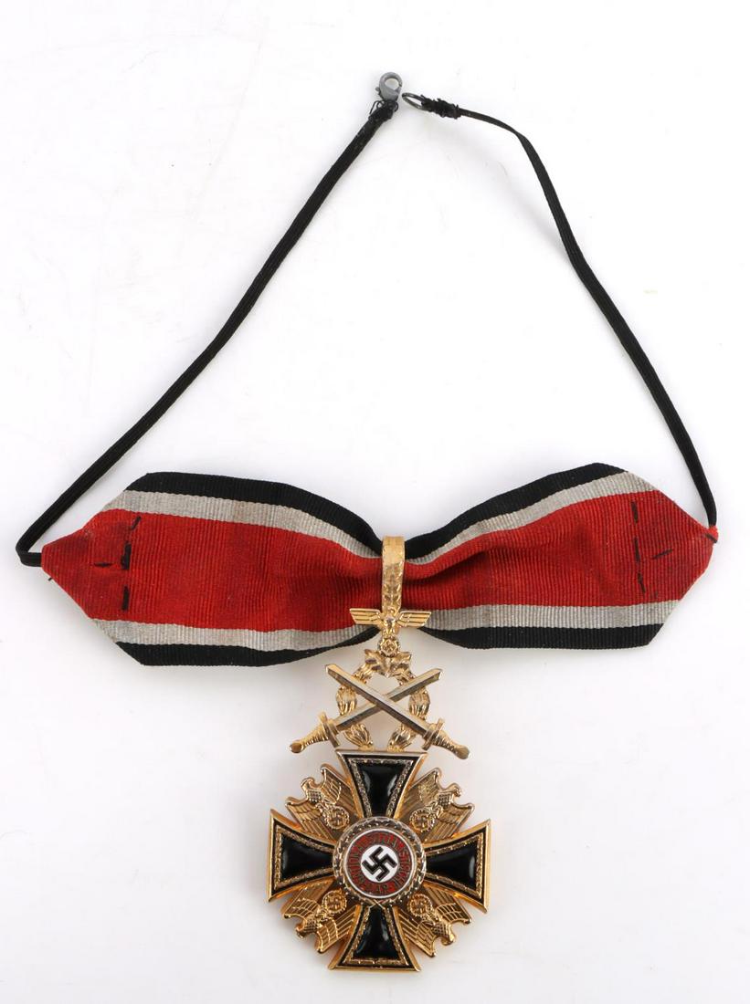 WWII GERMAN THIRD REICH ORDER OF DEAD NECK ORDER: German WWII Order Of The Dead Neck Order with Swords. Measures 1 7/8 X 3 3/4 inches. The front shows a NSDAP party badge with a swastika in the center of the Maltese cross. It reads ‘National-Sozial