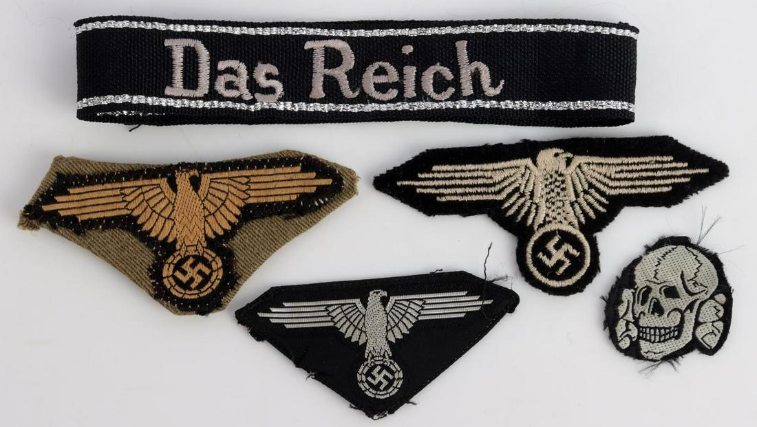LOT OF 5 WWII GERMAN THIRD REICH WAFFEN SS PATCHES: German WWII Waffen-SS Insignia Grouping. Includes: Waffen SS Das Reich cuff title; SS Tropical arm eagle on piece of tunic; Waffen SS arm eagle in wool; SS cap eagle in bevo; Waffen SS skull in bevo c