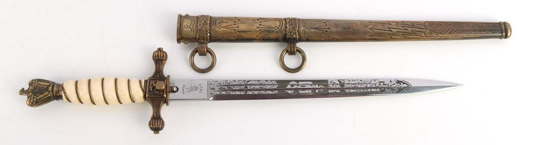 WWII GERMAN THIRD REICH KRIERGSMARINE DAGGER: German WWII Naval Kriegsmarine Officers Dagger and Scabbard. Measures 16 1/8 inches longoverall. The double engraved steel blade shows a U-Boat submarine on one side. Has theengraved floral and anchor