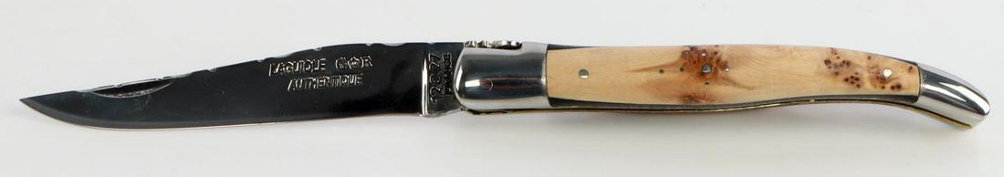 LAGUIOLE 12 C 27 POCKET KNIFE WITH CASE: Steel blade with burl wood grip. Measures 8.5 inches. Like new condition.