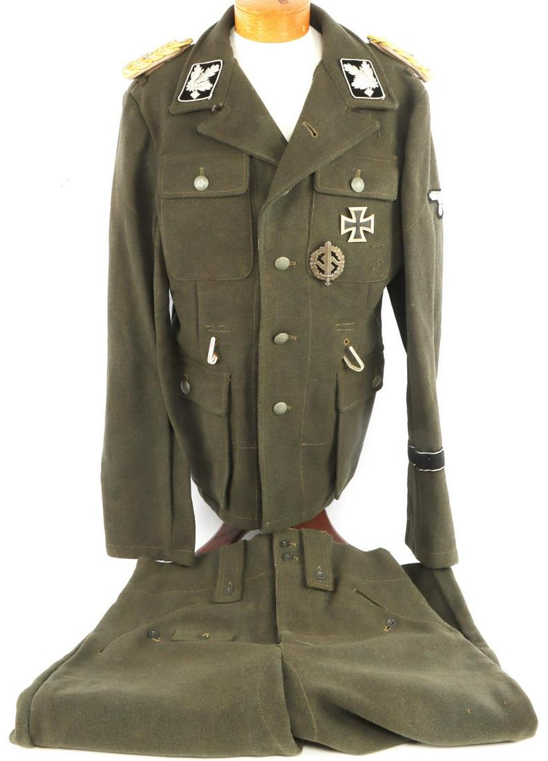 WWII NAMED SS GRUPPENFUHRER TUNIC & TROUSERS: Tunic features collar tabs, shoulder boards, Parteiadler patch, First Class Iron Cross marked L15 and weld seem, SA sports badge numbered 819873 with maker's mark, black wound badge, and a totenkopf c