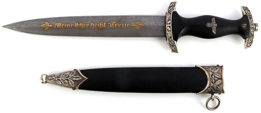 WWII GERMAN THIRD REICH SS HONOR DAGGER: Damascus blade with Eickhorn maker mark. Housed in leather bound scabbard. Measures 14 5/8 inches. Collector's copy.