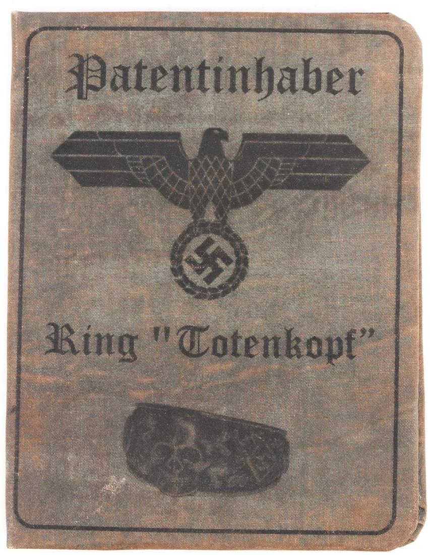 WWII GERMAN TOTENKOPF RING PRESENTATION FOLDER: German WWII totenkopf ring presentation folder. This item contains information about the totenkopf ring and a photograph of Himmler. The item has two official seals and a faint signature. This is not 