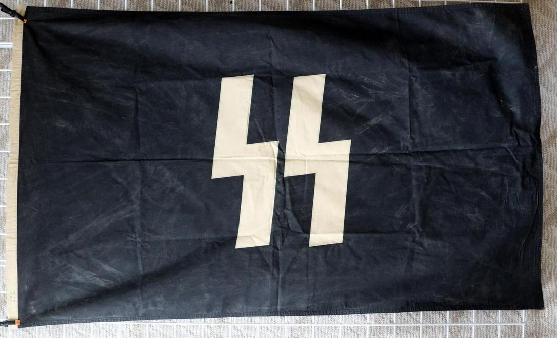 WWII GERMAN THIRD REICH SS FLAG BANNER: Hoist is stamped SS KR FL 90X150 (centimeters), does not fluoresce at any spot, heavy cotton and double stitched throughout. In very good original condition.