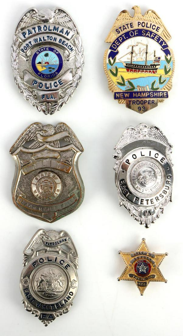 6 OBSOLETE STATE POLICE PATROLMAN BADGE LOT: 6 obsolete police badges of State Police and City Police from various locations. One New Hampshire State Trooper #93. 180 Degree lie pin. Enamel damaged near top of the boat. 3 X 2 1/4 inches. One For