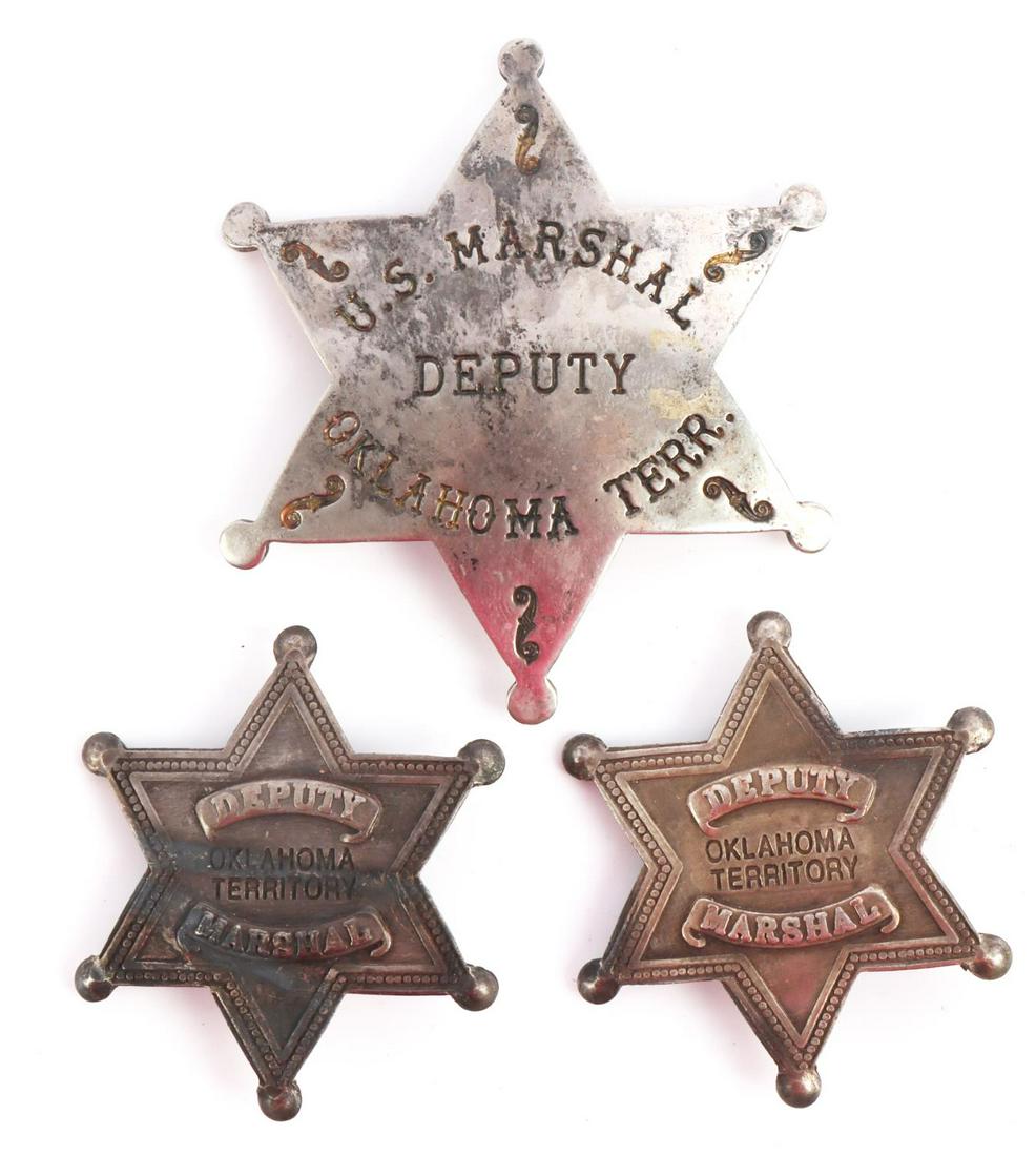 3 OBSOLETE DEPUTY MARSHAL OKLAHOMA TERRITORY: 3 six point star United States Deputy Marshall Oklahoma Territory badges. Sizes are 3 1/2 X 3 inches and 2 1/4 X 2 inches. Safety pins on the back for clipping. In very good condition with minor patin