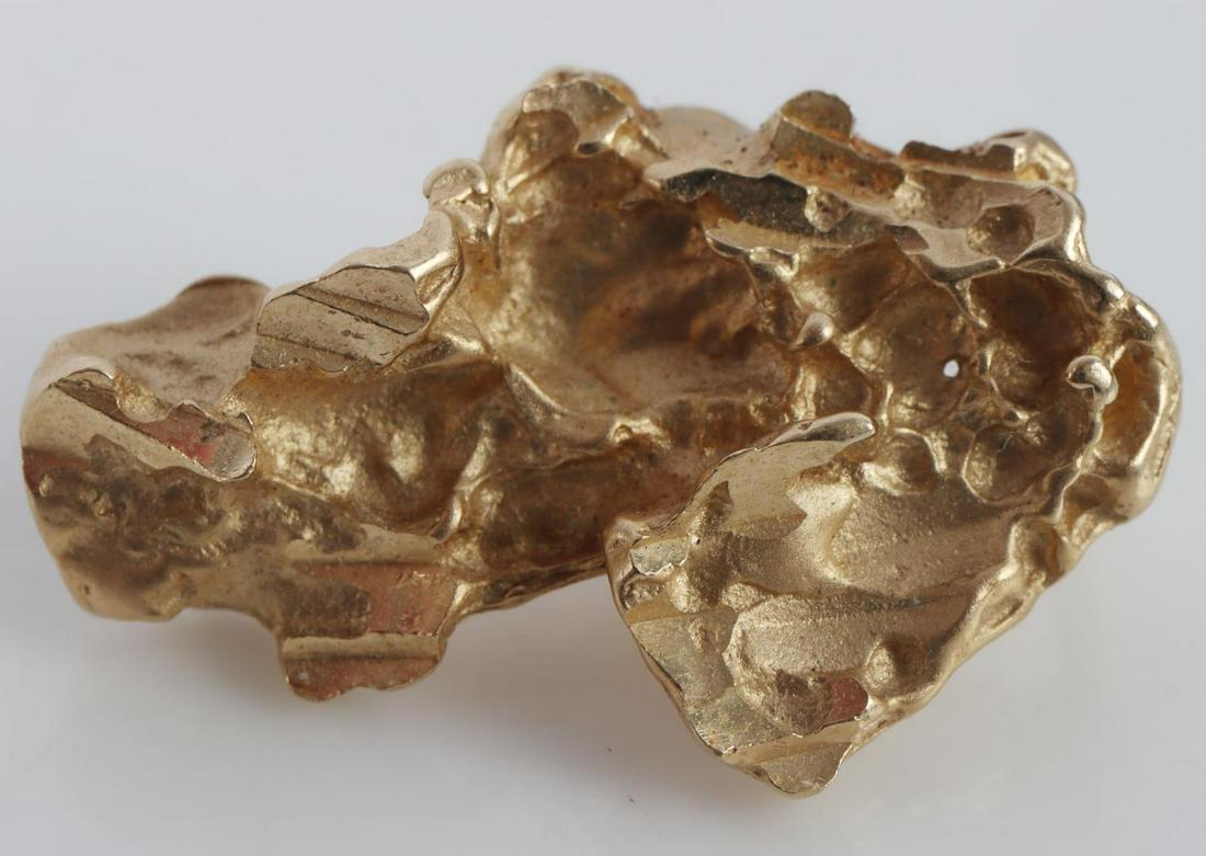 14KT GOLD NUGGET STYLE PENDANT: Total weight of 1.9 grams and measures 17x11mm. This lot has a reserve.