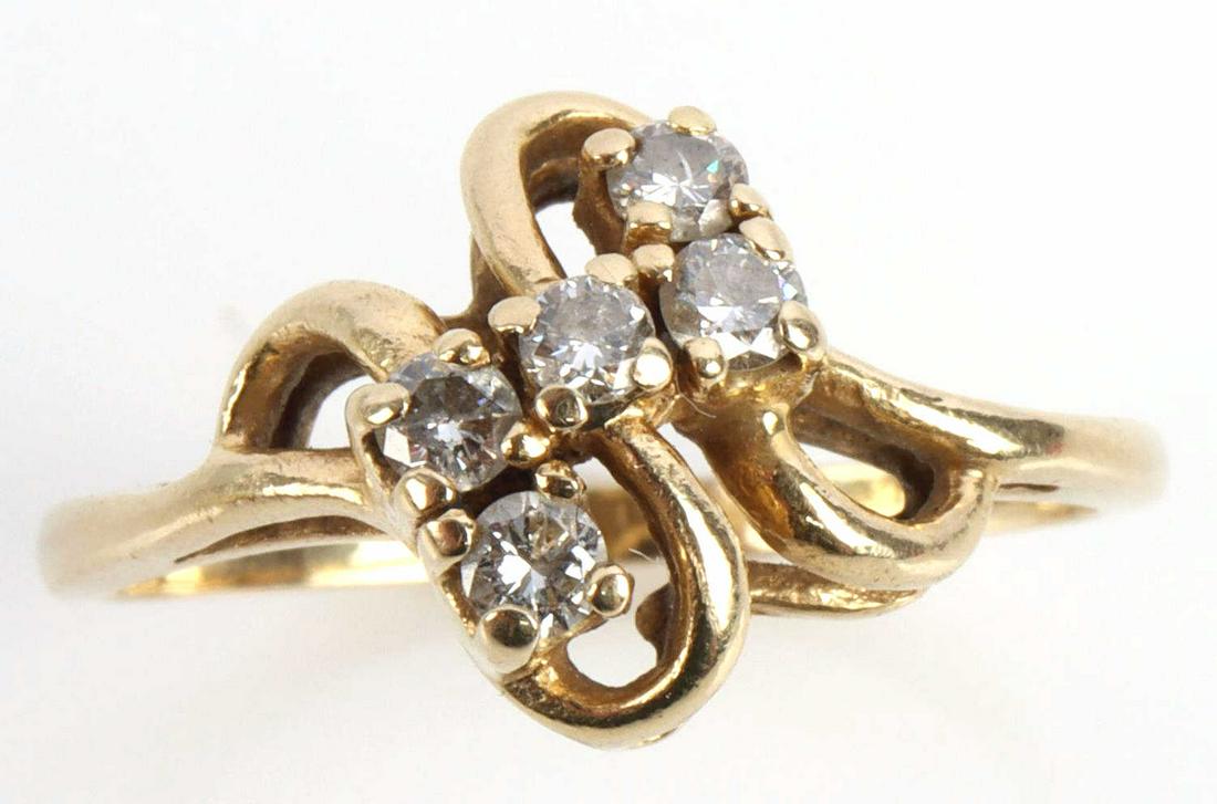 VINTAGE 14KT GOLD AND DIAMOND RING SZ 6: Vintage freeform ring in 14kt gold with five 2mm diamonds totaling 0.15 TCW. Size 6. Total weight of 2.5 grams. This lot has a reserve.