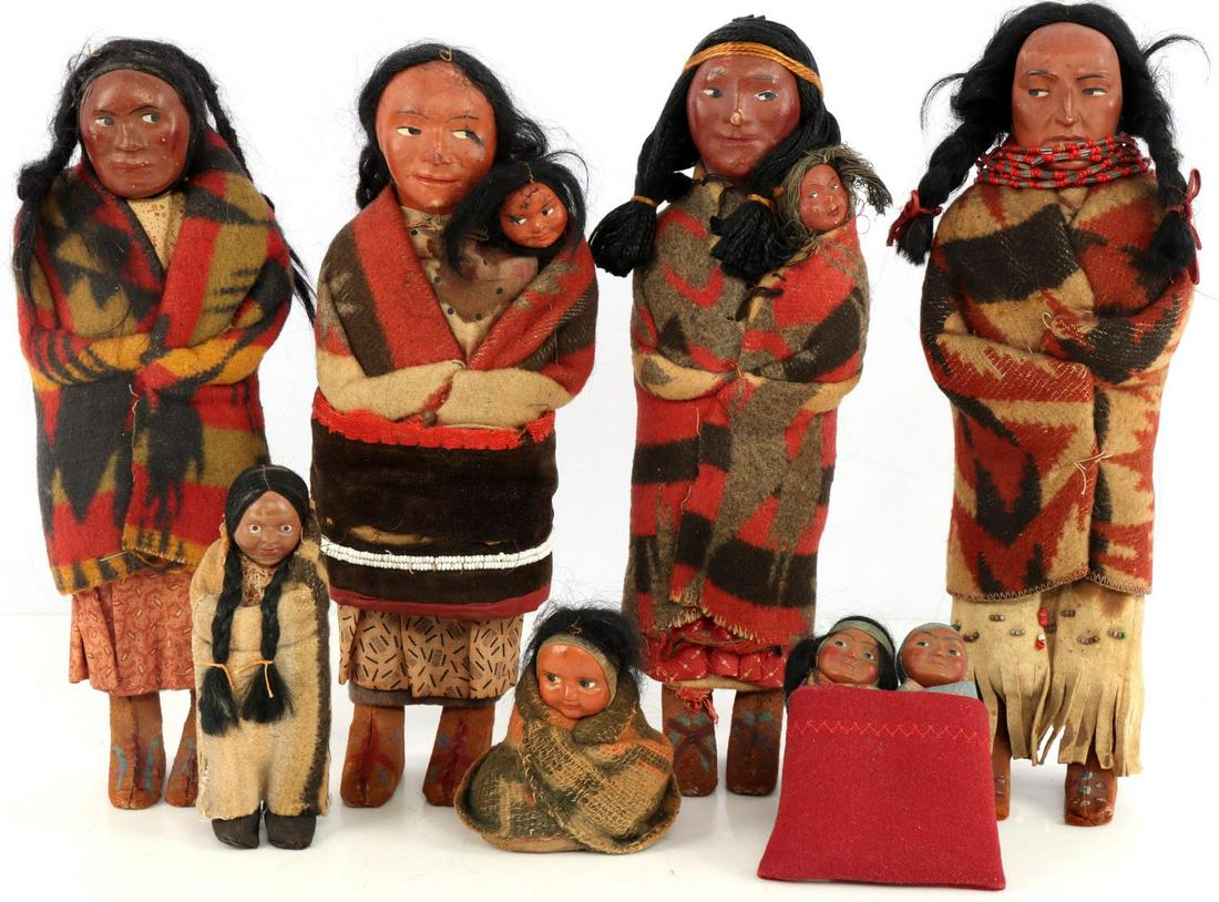 EARLY 20TH CENTURY SKOOKUM INDIAN DOLL LOT OF 7: Seven various 1920's to 1940's Native American Skookum dolls. Skookum dolls are costumed in stylized garb of many different tribes including the Pueblo, the Sioux, the Apache, and the Chippewa. Height
