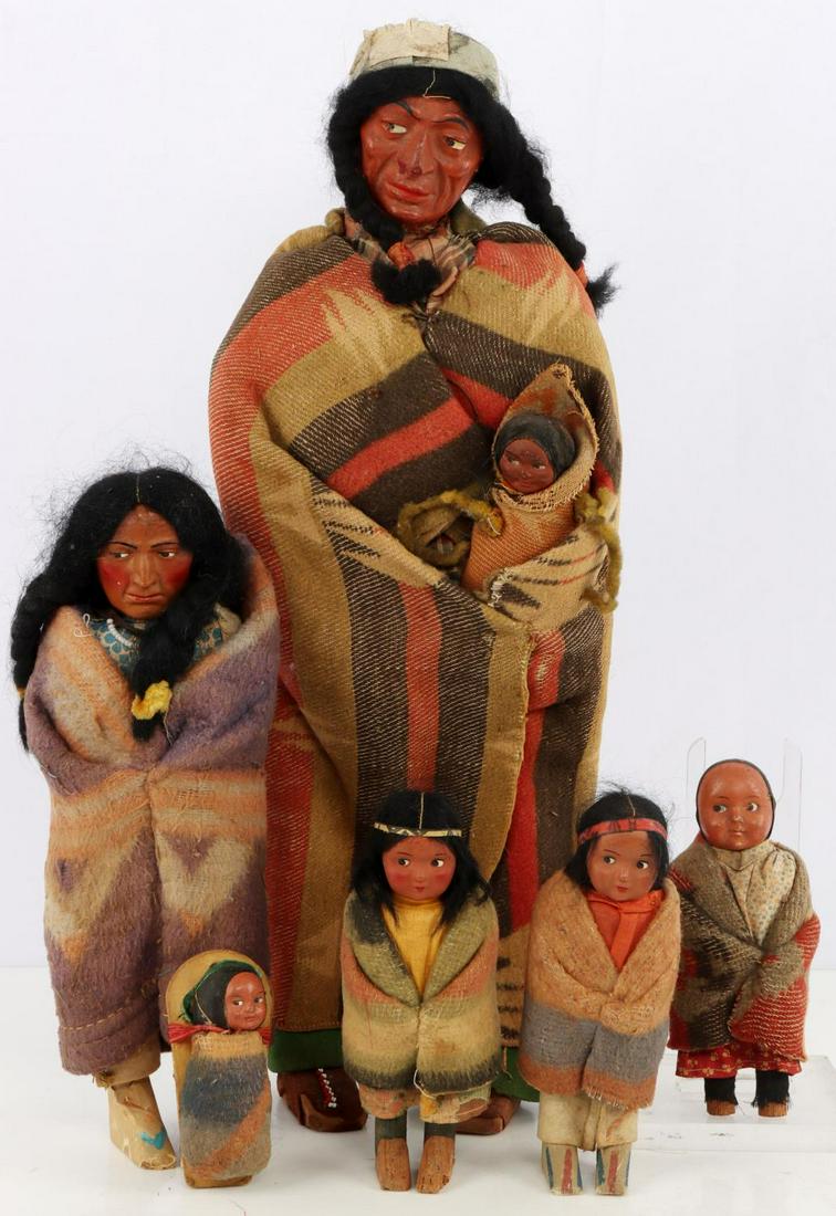 EARLY 20TH CENTURY SKOOKUM INDIAN DOLL LOT OF 6: Six various 1920's to 1940's Native American Skookum dolls. Skookum dolls are costumed in stylized garb of many different tribes including the Pueblo, the Sioux, the Apache, and the Chippewa. Heights 