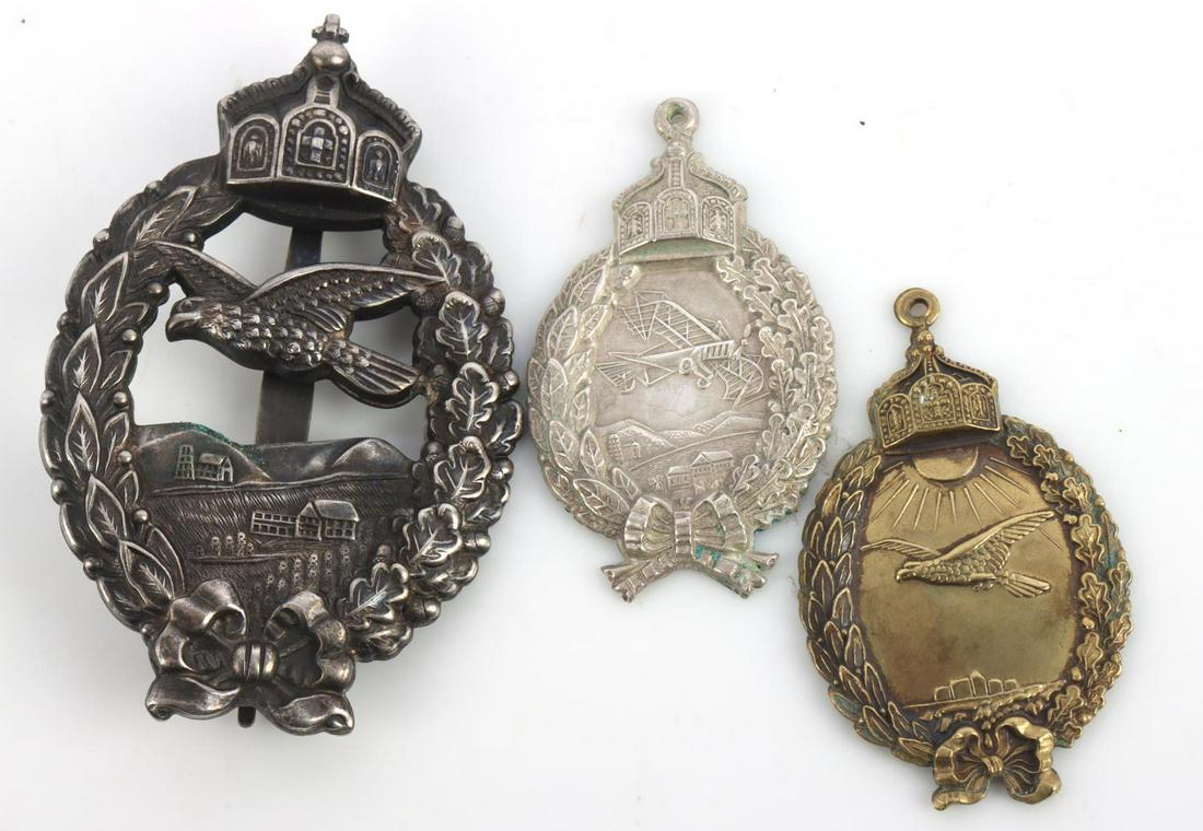 WWI IMPERIAL GERMAN PILOT BADGES LOT OF 3: Lot features 2 retired pilot badges in large and small variants and a small pilot badge. Measures 2 & 2 7/8 inches. This lot has a reserve.