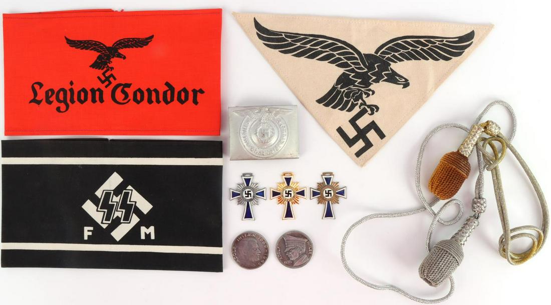 11 WWII GERMAN ARMBANDS MEDALS BELT BUCKLE LOT: Post-WWII German made armbands, patch, medals, coins, portepees, and belt buckle. One Legion Condor armband, one Waffen-SS FM armband, one Luftwaffe patch, Waffen-SS belt buckle, three Mother's crosse