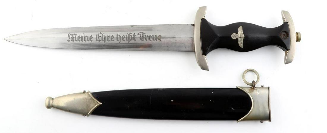 WWII GERMAN THIRD REICH SS HONOR DAGGER: Steel blade with etched motto. SS RZM 121/34 marked. Housed in steel scabbard. No marks on interior of nickel crossguards. Few filing marks on tang. Very good condition. Slight splitting at chape and