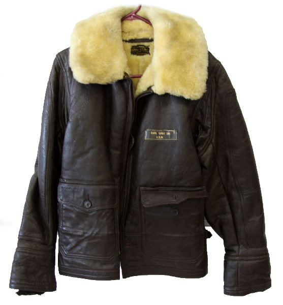 US NAVY M445 HEAVY WINTER FLIGHT JACKET FLEECE: A fleece lined M-445 leather heavy winter flight jacket, U.S. Navy named to Earl Gray Store Keeper 1, very good wearable condition about a 40, the sleeve endings are worn but not visible, some minor l