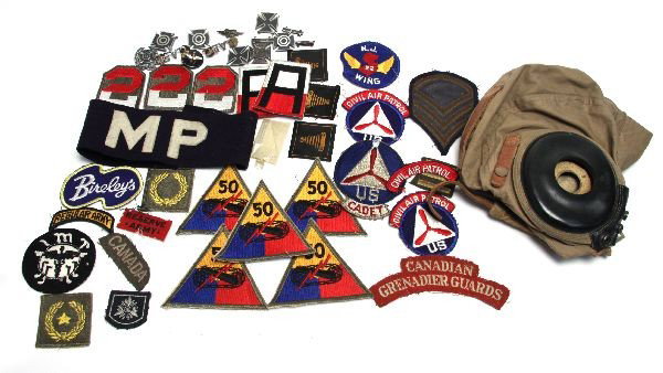 WWII ERA US MILITARY BADGES PINS & FLIGHT HELMET: Lot of WWII era US patches, pins, and AN-H-15 flight helmet. Among the patches are tank destroyer units, Civil Air Patrol, CAP Cadet, MP, marksman pins Canadian Grenadier Guards, and more. All in good