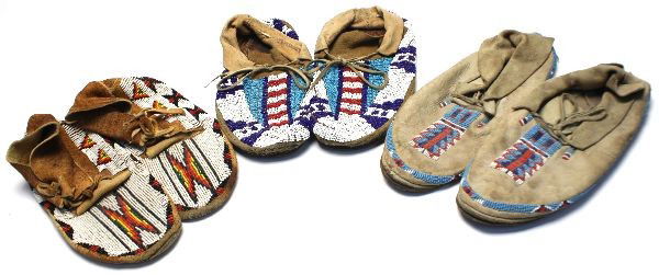 3 PAIRS OF BEADED ANTIQUE INDIAN MOCCASINS: Grouping of three pairs of beaded native American traditional moccasins, two are circa 1940 the third newer, all wearable size 9 approximately.