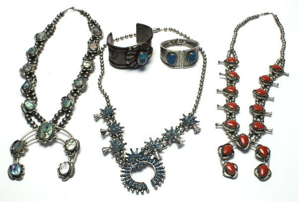 THREE ANTIQUE NAVAJO SQUASH BLOSSOM NECKLACE MORE: Mixed lot of antique Native American jewelry including three Navajo Squash Blossom necklaces (silver, turquoise, coral colored), Silver plated and turquoise bracelet, and silver and turquoise colored