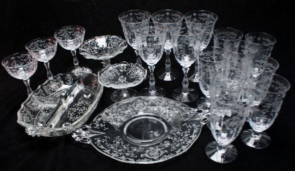 MIXED LOT OF FOSTORIA NAVARRE CLEAR CRYSTAL: Mixed lot of twenty Fostoria Navarre floral etched crystal. Including one three part relish dish, one 10 inch cake plate, five water goblets, three tall sherbets, eight footed iced tea tumblers, one c