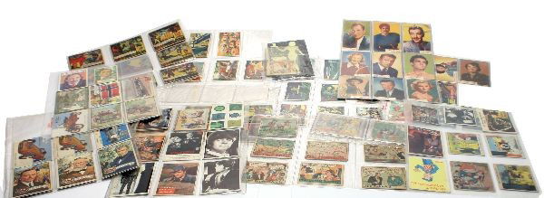 LOT OF 90 VINTAGE MOVIE & GUM BALL TRADING CARDS: Lot of 90 vintage trading cards. Features two1930s Mickey Mouse (79 and 54), 1930s Bronco Bill (424), 1930s Tarzan of the Apes (416), 1930s Little Orphan Annie (115), four glow in the dark pin ups, Cr