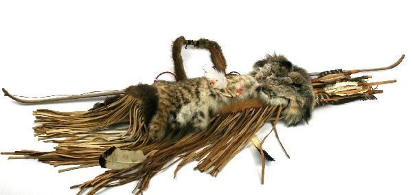 BOBCAT AND MINK QUIVER W/ 17 ARROWS VINTAGE BOW: Bobcat and Mink Quiver with fringes and feathers includes 17 arrows with vintage bow. Bow measuring 54 inches long. Quiver measuring 21 inches long and 6 inches wide. In good condition.