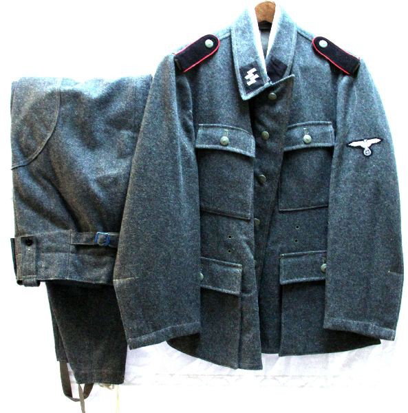 WWII WAFFEN SS ARTILLERY TUNIC & TROUSERS: Spurious WWII Waffen SS tunic and trousers. Wearable size 42, all wool free of mothing. Artillery piping to shoulder straps, some patches may possibly be original but best served as a re-enactor piece