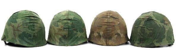 GROUPING OF 4 VIETNAM ERA M1 HELMETS WITH LINERS: Grouping of (4) swivel bale M-1 helmets circa Vietnam to 1970's. All have liners and reversible Mitchell camouflage covers. Used but overall good condition.