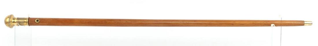 ANTIQUE SYSTEM WALKING CANE STICK CIGAR LIGHTER: Grip twist off to reveal cigar or cheroot lighter. Flint wheel unscrews to change flint or add fluid. seems to be in good working condition. Features heavy brass fittings, smooth blond wood, and measu