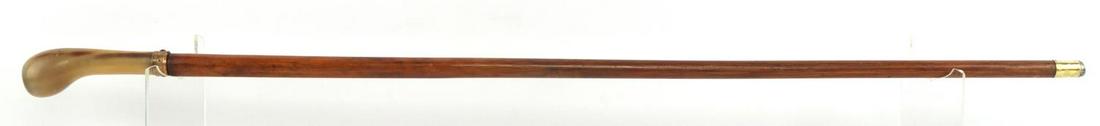 ANTIQUE SWORD CANE W COMPASS INSERT IN HORN GRIP: Features a horn grip with an inserted compass and gold fill wrap with a push button to release. It works intermittingly and has an overall length of 32 1/2 inches. Grip with blade measures 16 1/2 inch