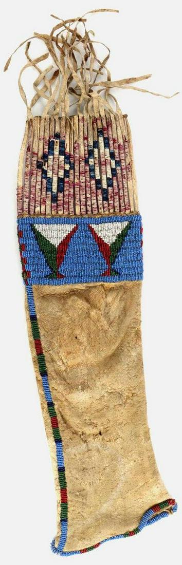 PLAINS INDIAN TOBACCO PIPE BEADED BUCKSKIN BAG: 18th to 19th century Plains Indian brain tanned deer skin pipe bag adorned with glass beads and porcupine quills. Bag is soft with some age appropriate wear and staining. Total length with fringe is 2