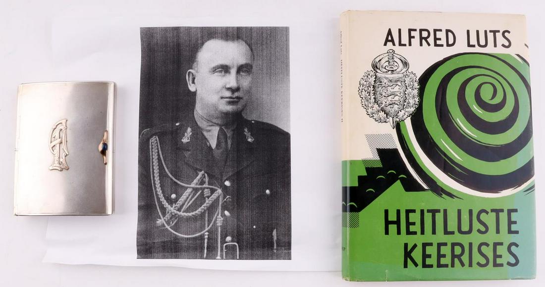 ALFRED LUTS PERSONAL CIGARETTE HOLDER SIGNED BOOK: Hallmarked with 87.5 silver purity. Weighs 198.5 grams. Measures4 3/8 X 3 3/8 inches. Possibly gold or gold fill A L monogram fastened to lid. Comes with signed copy of his book "Heitluste Keerises" G
