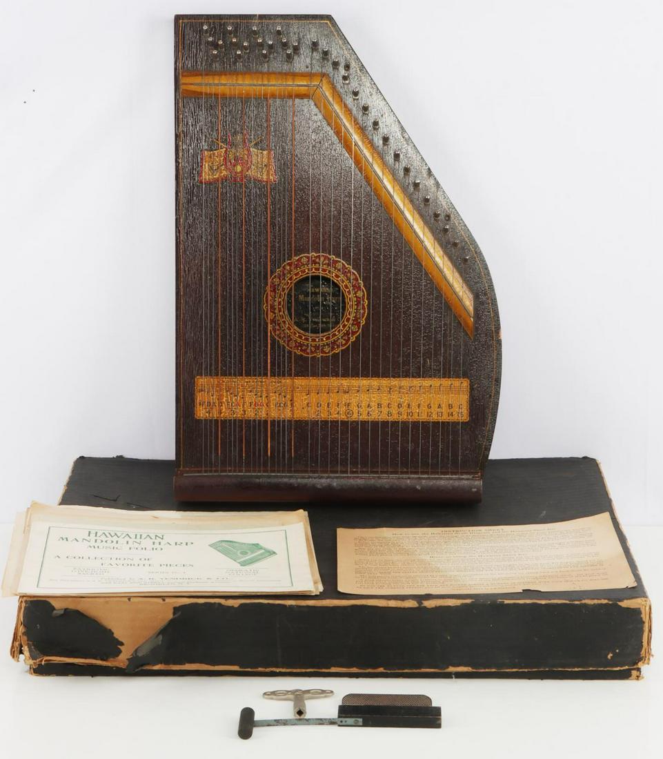 AR YENDRICK & CO HAWAIIAN MANDOLIN HARP: Antique A.R. Yendrick Mandolin Harp in original box with tuning instruments. Measures 19x13 inches. Very good condition with craquelure patina, back panel has crack.
