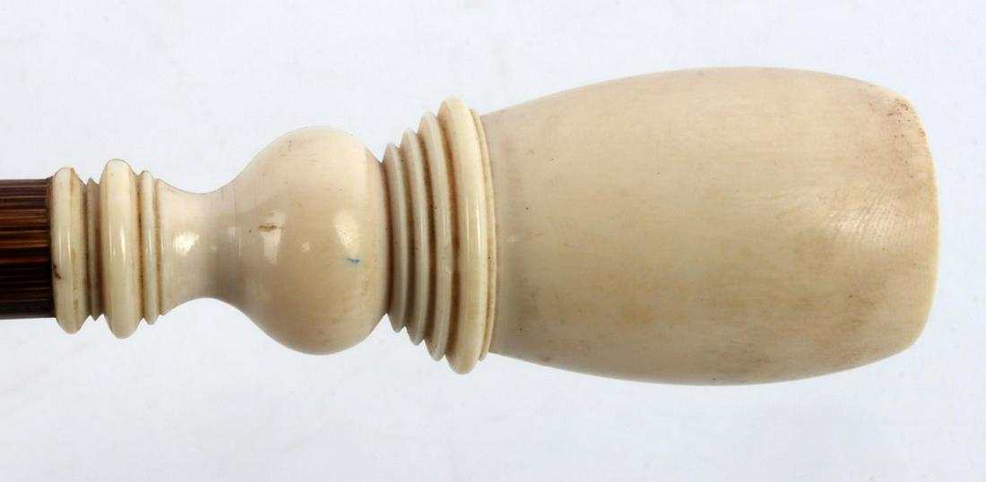 MAMMOTH FOSSIL IVORY ANTIQUE WALKING CANE STICK: Clear fossil Schreger lines and original horn ferrule in very good original condition. Measures 34 3/4 inches.