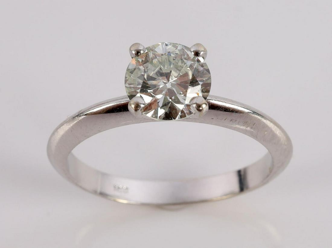 14KT GOLD 1 CT DIAMOND SOLITAIRE ENGAGEMENT RING: 14 kt white gold, diamond measures approx. 6.5 x 3.5mm for a total of nearly 1 carat. Color G-J, clarity VS to SI, 1 imperfection on face of girdle noted under 10x loop. Size 7. Nice eye appeal This l