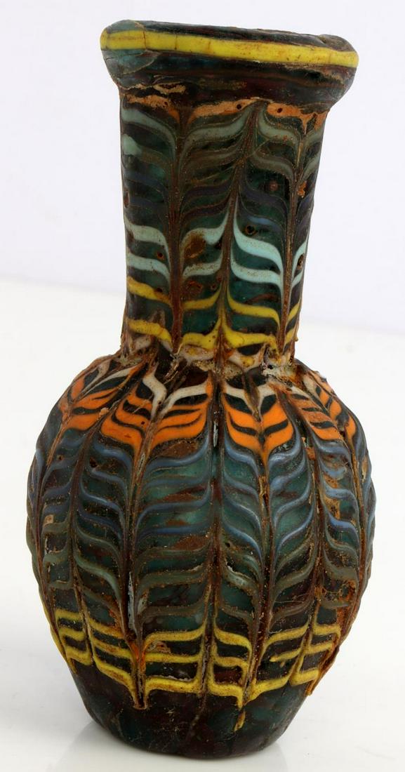 ANCIENT PHOENICIAN MOSAIC GLASS BOTTLE: Approximately circa 300 B.C. Measures 3.5 inches. Very good condition.