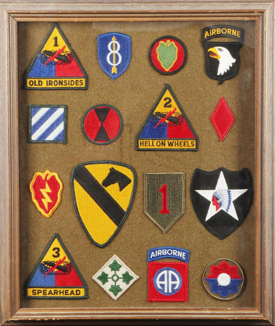 DISPLAY OF 16 US MILITARY PATCHES AIRBORNE ARMORED: A display of 16 United States military patches including: a 1st Armored Division Old Ironsides shoulder patch, an 8th Infantry Division shoulder patch, a 24th Infantry Division patch, a 101st Airborne