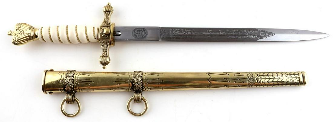 WWII GERMAN KRIEGSMARINE DAGGER WITH SCABBARD: A 2nd Model Dress Dagger, makers marked on ricasso E. Bonsmann Solingen. White grip with wire braiding and gold colored plated Kriegsmarine eagle pommel and crossguard.. Catch and release button for r