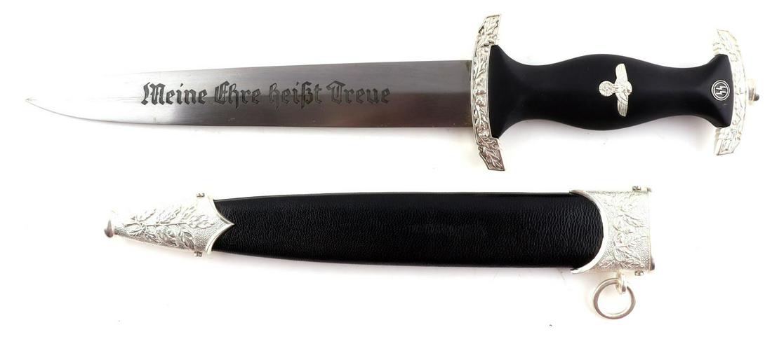 WWII GERMAN SS HONOR DAGGER BY EICKHORN W SCABBARD: A WWII German SS dagger by Eickhorn Solingen. he black wooden grip has an eagle with clutched swastika inlay. The reverse of the blade is marked Carl Eickhorn Solingen and full dedication "In herzlich