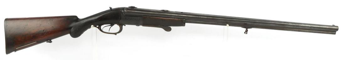 BELGIAN DRILLING COMBINATION ENGRAVED SXS SHOTGUN: Barrels measure 28 1/2 inches long, featuring bright and clear bores with good rifling in bottom barrel. Action functions and can be a little stiff. Dozens of markings underneath barrel, including Lie