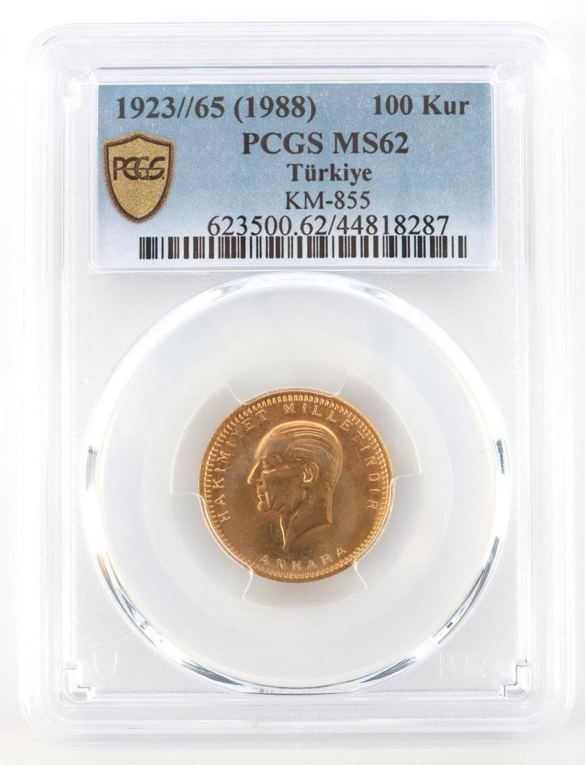 1988 TURKIYE 1923/65 100 KURUSH GOLD PCGS MS62: Turkey 100 Kurush KM# 855 1923/47 Mustafa Kemal Atatürk. PCGS graded Mint State 62. Gold composition, 91.7% fineness, and weighs 7.2 grams. This lot has a reserve.