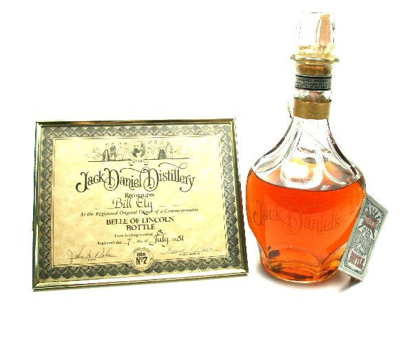 JACK DANIELS BELLE OF LINCOLN TENNESSEE WHISKEY: 1.75 litter Bottle of Jack Daniels The Mystery of the Belle of Lincoln bottle Tennessee whiskey with C.O.A. from Jack Daniel Distillery. Comes with tag describing the Mystery of the Belle and a band o